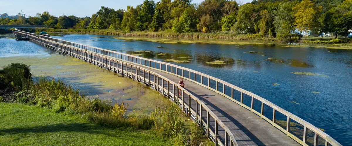 Towpath on bridge over water, long view.